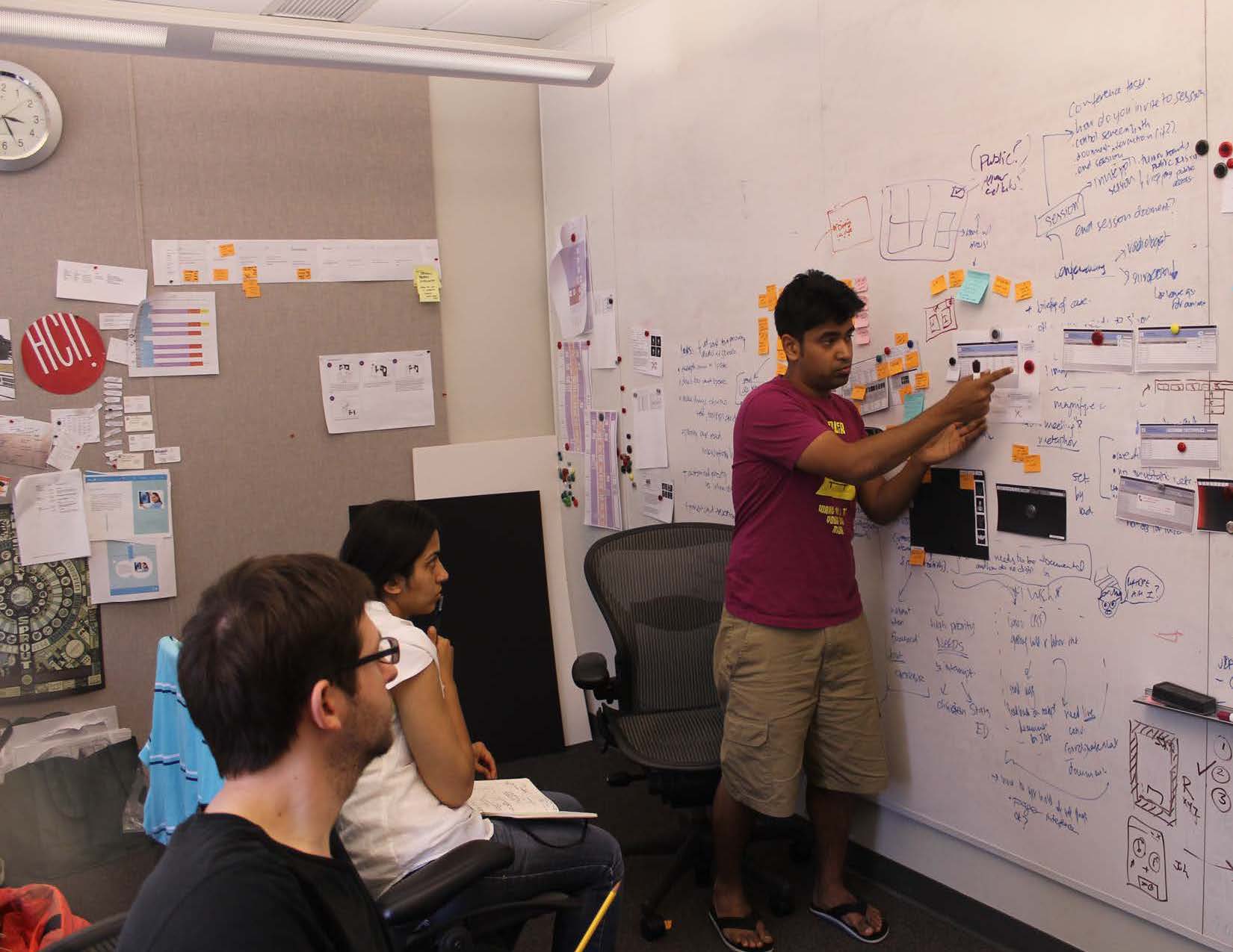 Asim Mittal leading an exercise common among programmers in which inessential features are stripped away from the solution so the most important features can receive more attention