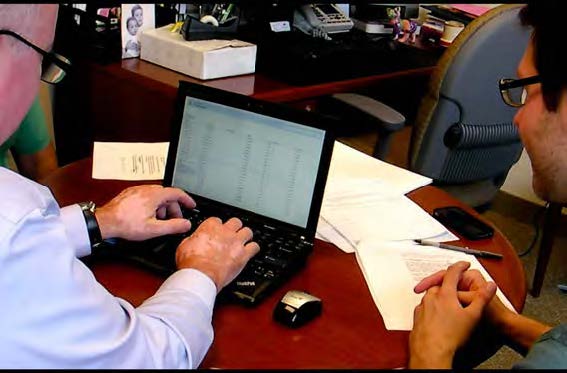 A radiologist types on one of our laptops within the first iteration of our software prototype